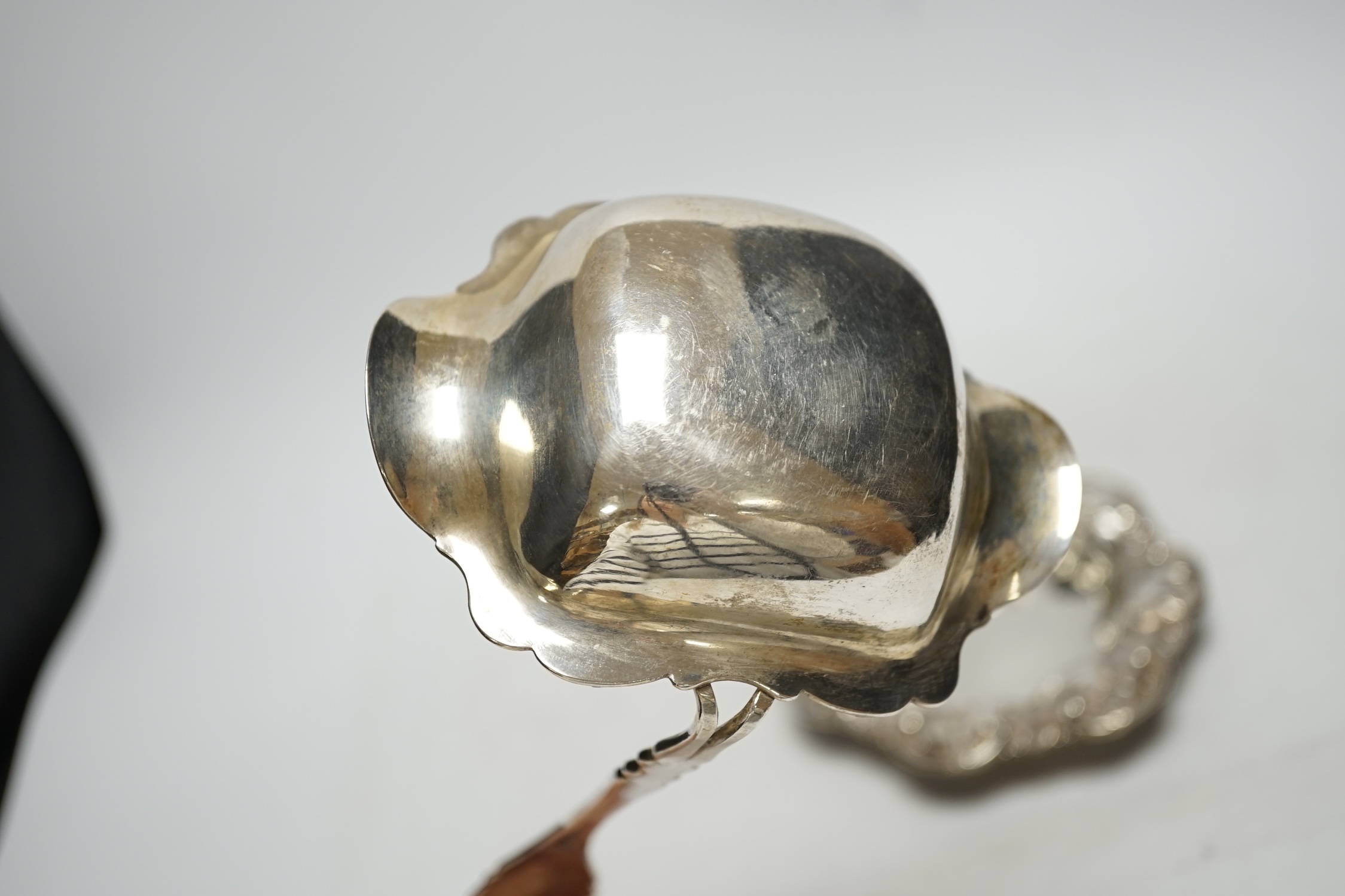 A Dutch white metal soup ladle, 29.5cm and a sterling small dish, 9.3oz.
